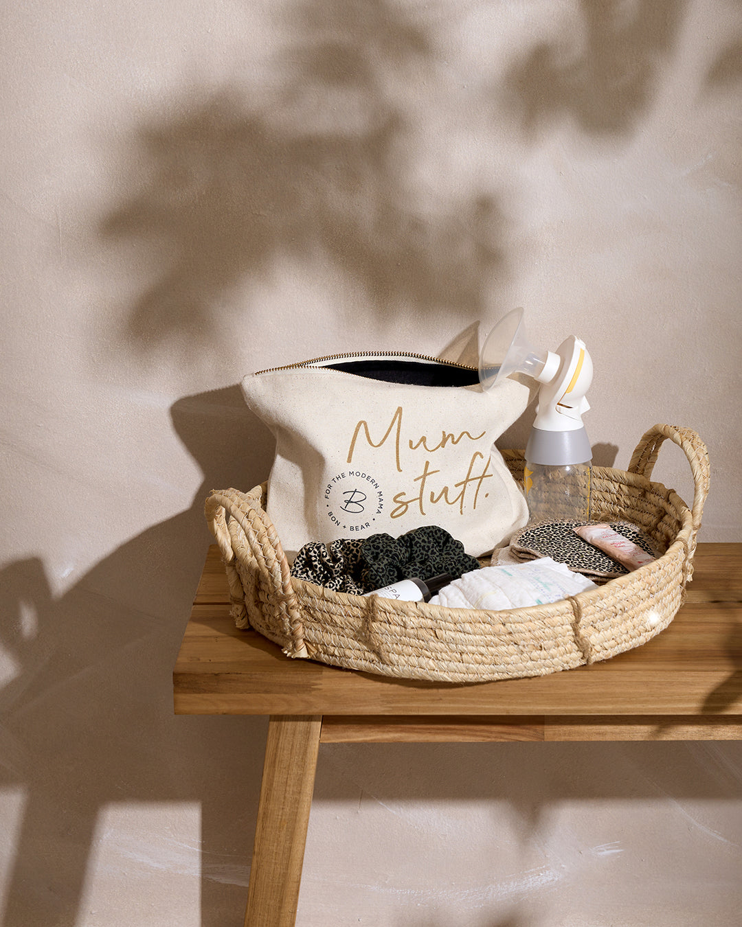 zip-nappy-pouch-in-basket-tray-with-breastpads-breastpump-hair-scunchies-laid-to-the-side-bon-and-bear