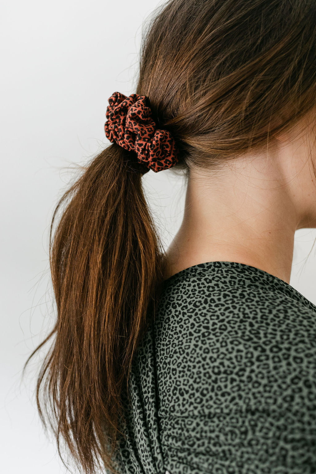 mums-head-with-hair-in-low-ponytail-with-red-leoaprd-print-scrunchie-bon-and-bear