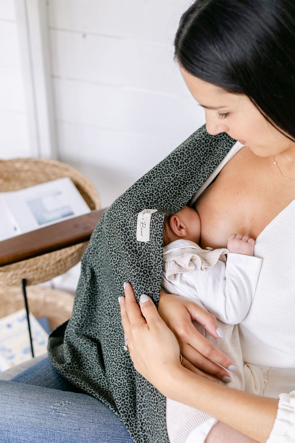 mum-looking-dsown-at-baby-breastfeeding-with-breastfeeding-cover-sat-in-chair-bon-and-bear