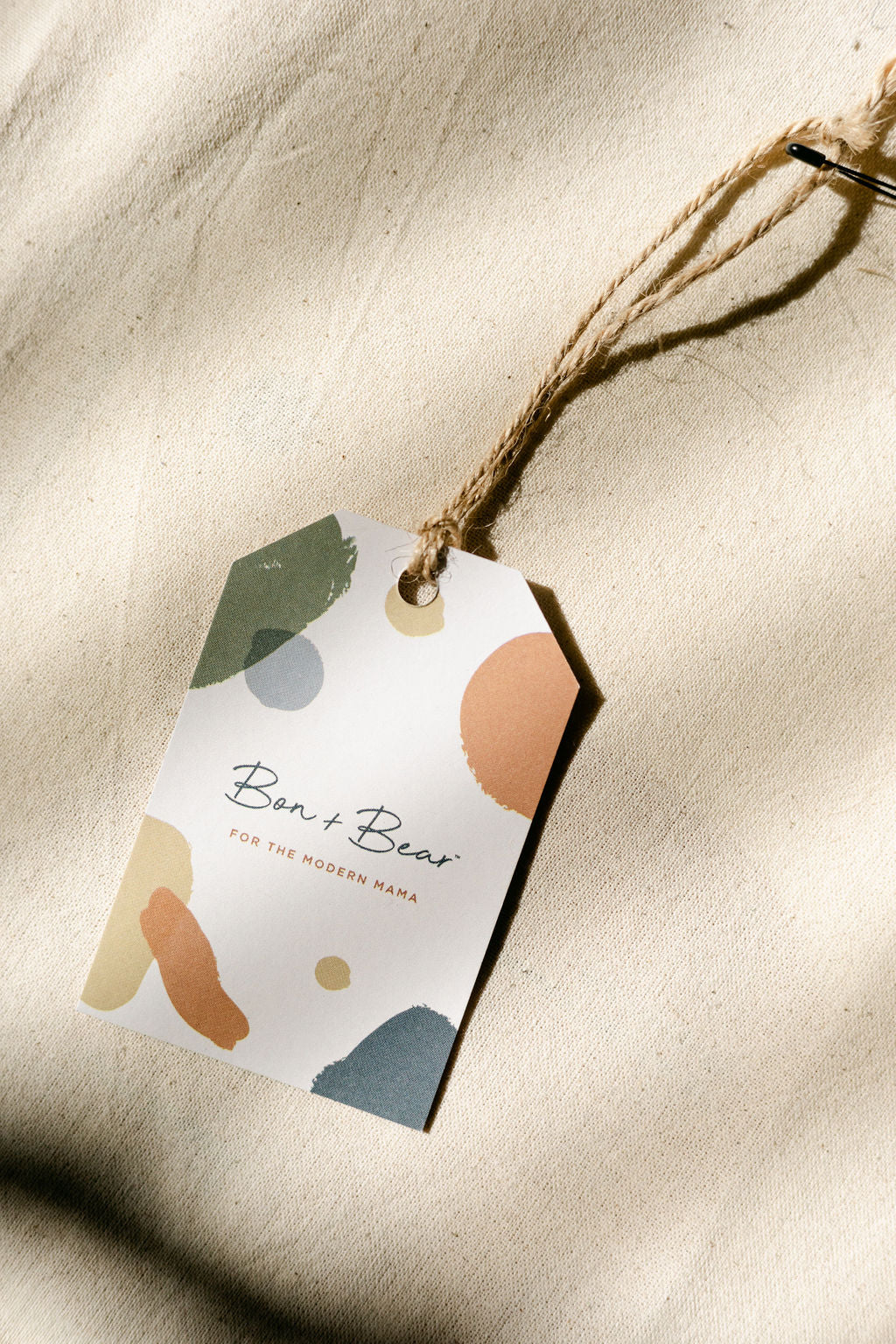 bon-and-bear-gift-tag-laid-on-fabric