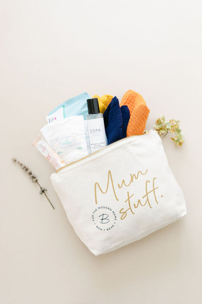 gold-zip-white-nappy-pouch-with-mum-stuff-logo-on-the-front-with-baby-muslins-nappies-wipes-stuffed-in-the-top-opening-bon-and-bear